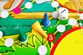 Blue, green and yellow plastic chips and dice in old Board games for children Royalty Free Stock Photo