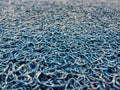 Blue grey curly patterned rubber mat background