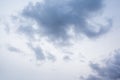 Blue-grey dark clouds moving across a cloudy white cloudy sky. Royalty Free Stock Photo