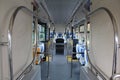 Blue and grey seats for passengers in saloon of empty city bus Royalty Free Stock Photo