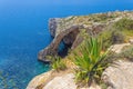 Blue Grotto rock cliff arch in Malta, aerial view from the Mediterranean Sea to the island Royalty Free Stock Photo