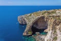 Blue Grotto rock cliff arch in Malta, aerial view from the Mediterranean Sea to the island Royalty Free Stock Photo