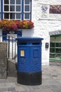 Blue Guernsey Post Box unique to Guernsey in the town of St Pierre Port St Peter Port, the main settlement of Guernsey, The Royalty Free Stock Photo