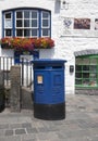 Blue Guernsey Post Box unique to Guernsey in the town of St Pierre Port St Peter Port, the main settlement of Guernsey, The Royalty Free Stock Photo