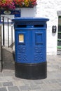 Blue Guernsey Post Box unique to Guernsey in the town of St Pierre Port St Peter Port, the main settlement of Guernsey, The Royalty Free Stock Photo