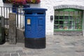 Blue Guernsey Post Box unique to Guernsey in the town of St Pierre Port St Peter Port, the main settlement of Guernsey, The Royalty Free Stock Photo