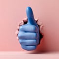 Blue hand giving thumbs up through a hole in pink paper. Royalty Free Stock Photo