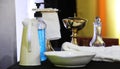 Covid safe going to church. Hand sanitizer amongst the holy communion vessels and objects. Royalty Free Stock Photo