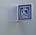 Blue Handicap Elevator Sign on Metallic Wall, Closeup