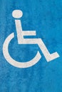 Blue handicap parking sign on asphalt for persons with disability Royalty Free Stock Photo