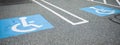 Blue handicap sign on the street - a symbol for mobility aid for people with disabilities