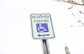 Blue handicap sign on the street - a symbol for mobility aid for people with disabilities Royalty Free Stock Photo