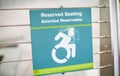 Blue handicap sign on the street - a symbol for mobility aid for people with disabilities Royalty Free Stock Photo