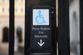 Blue handicap sign on the street - a symbol for mobility aid for people with disabilities Royalty Free Stock Photo