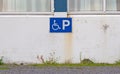 Blue handicapped parking sign for disabled drivers Royalty Free Stock Photo