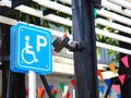 Blue handicapped parking sign at petrol station. Royalty Free Stock Photo