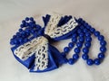 Blue Bow and a String of Pearls Royalty Free Stock Photo