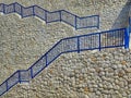 Blue Handrails on High Dry Stone Wall