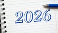 Blue 2026 Handwritten on Lined Paper with Pen Royalty Free Stock Photo
