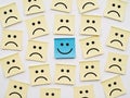 Blue Happy Face Sticky Note Stands Out Among Sad Yellow Notes Royalty Free Stock Photo