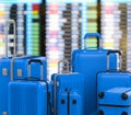 Blue hard case luggages with airport background Royalty Free Stock Photo