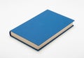 Blue hardcover book resting on a white surface. The book has a plain cover with a m Royalty Free Stock Photo