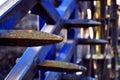 Blue harrow, agricultural machine, with rusty spikes Royalty Free Stock Photo