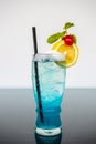 Blue Hawaiian Cocktails with lime and cherry decoration Royalty Free Stock Photo