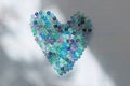 Blue heart made of natural tourmaline stones. Unusual surreal design