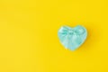 Blue heart shape decorative gift box with blue bow on yellow background. Valentine`s day, love, wedding, Royalty Free Stock Photo