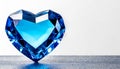 Blue heart shaped diamond on white background and copy space on a side Royalty Free Stock Photo