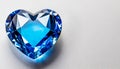 Blue heart shaped diamond on white background and copy space on a side Royalty Free Stock Photo