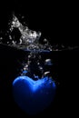 Blue heart splashing on water