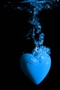 Blue heart splashing on water Royalty Free Stock Photo