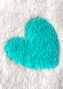 Blue heart on white blanket material Royalty Free Stock Photo