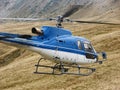 Blue helicopter flying