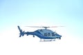 A blue helicopter flying in the sky Royalty Free Stock Photo