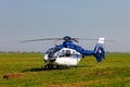 Blue helicopter on field Royalty Free Stock Photo