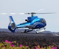 Blue helicopter landing