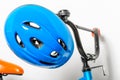 blue helmet for children on the handlebars of a children`s bicyc