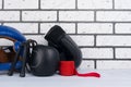 Blue helmet, jump ropes, protective bandages and gloves for boxing, against a light brick wall, there is a place for inscription Royalty Free Stock Photo
