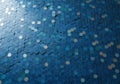 Blue hexagonal tiles form a mosaic pattern across the surface, creating a visually dynamic texture. Royalty Free Stock Photo