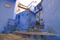 Blue historical streets of Morocco. Tiled sheds on the windows are very nice