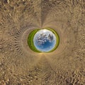 blue hole sphere little planet inside gravel sand round frame background Royalty Free Stock Photo