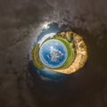 blue hole sphere little planet inside sand or dry grass round frame background Royalty Free Stock Photo