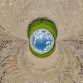 blue hole sphere little planet inside sand round frame background Royalty Free Stock Photo