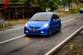 Blue Honda Jazz or Honda Fit sport Vtec on the road Royalty Free Stock Photo