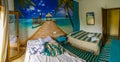 Blue hotel room with palm tree paradise wallpaper in Mallorca Royalty Free Stock Photo