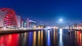 Blue hour at Dublin docks. Beautifully illuminated embankment and harbour