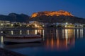 Blue hour at Haraki Charaki overlooking the harbor and the castle in the distance, Rhodes Island, Greece